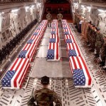 American flag over coffins in plane
